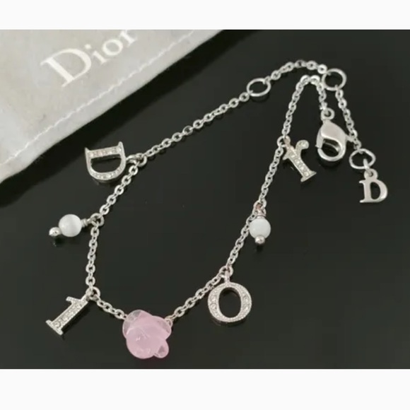 Dior Jewelry - Christian Dior Silver Rose Motif and Rhinestone Logo
Bracelet